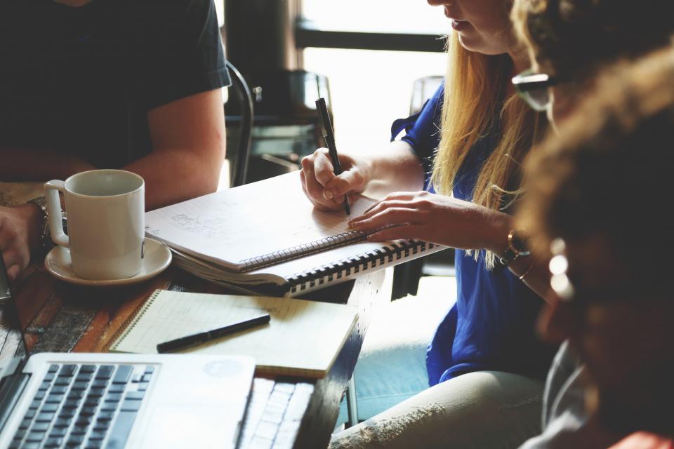 Sales team in a business meeting developing professional selling skills